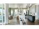 Modern kitchen with white cabinets, an island, and an open floor plan at 16985 Black Rose Pl, Parker, CO 80134