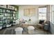 Modern home office with built-in shelving and large window at 16985 Black Rose Pl, Parker, CO 80134