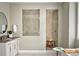 Spa-like bathroom featuring a walk-in shower and modern vanity at 16985 Black Rose Pl, Parker, CO 80134
