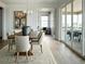 Elegant dining room with hardwood floors and access to deck at 16985 Black Rose Pl, Parker, CO 80134