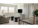 Spacious loft area with comfortable seating and built-in entertainment center at 16985 Black Rose Pl, Parker, CO 80134