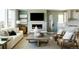 Bright living room features a fireplace and open floorplan at 16985 Black Rose Pl, Parker, CO 80134