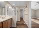 Bathroom with shower, vanity, and access to closet at 3502 S Lisbon St, Aurora, CO 80013