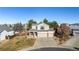 Two-story house with a two-car garage and landscaped yard at 3502 S Lisbon St, Aurora, CO 80013