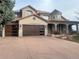 Two-story house with a three-car garage and landscaping at 7056 S Picadilly St, Aurora, CO 80016