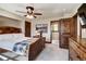 Spacious bedroom with wooden bed frame and access to bathroom at 105 Christie Ln, Breckenridge, CO 80424