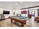 Basement recreation room with pool table, seating, and large TV at 105 Christie Ln, Breckenridge, CO 80424