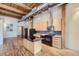 Modern kitchen with island and exposed ductwork at 2955 Inca St # 2N, Denver, CO 80202