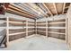 Unfinished basement area with additional storage shelving at 8336 Vivian St, Arvada, CO 80005