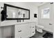 Modern bathroom with white vanity and marble shower at 5401 N Pecos St, Denver, CO 80221
