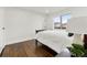 Bright bedroom with hardwood floors and a queen bed at 5401 N Pecos St, Denver, CO 80221