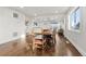 Hardwood floor dining room with farmhouse style table and chairs at 5401 N Pecos St, Denver, CO 80221