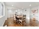 Bright dining room with hardwood floors and a rustic wooden table at 5401 N Pecos St, Denver, CO 80221