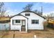 Front view of charming updated home with white exterior at 5401 N Pecos St, Denver, CO 80221