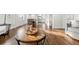 Open concept living room with hardwood floors and kitchen view at 5401 N Pecos St, Denver, CO 80221