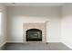 Living room with brick fireplace and neutral colored walls at 9231 Weeping Willow Ct, Highlands Ranch, CO 80130