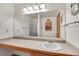 Clean bathroom with vanity, sink, and shower at 10475 W 82Nd Pl, Arvada, CO 80005