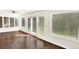 Bright sunroom with tile floor and sliding doors at 7100 E Virginia Ave, Denver, CO 80224