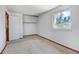 Bright bedroom with a closet and neutral wall-to-wall carpeting at 1487 S Zeno Way, Aurora, CO 80017