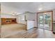 Living room with a brick fireplace and sliding glass doors to the patio at 1487 S Zeno Way, Aurora, CO 80017