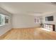 Bright living room with hardwood floors and large windows at 4897 Wren Ct, Frederick, CO 80504