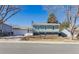 Ranch-style home with a two-car garage and mature trees at 1549 S Telluride St, Aurora, CO 80017