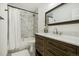 Updated bathroom features a marble shower, modern vanity, and elegant fixtures at 1549 S Telluride St, Aurora, CO 80017