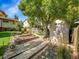 Landscaped backyard with garden and storage shed at 6430 S Kendall St, Littleton, CO 80123