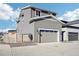 Two-story home with gray siding and attached garage at 7263 Goldbloom Ln, Littleton, CO 80125