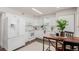 Modern kitchen with white cabinets and quartz countertops at 1646 S Deframe St # B1, Lakewood, CO 80228