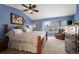 Main bedroom with a king-size bed and sitting area at 418 Tynan Ct, Erie, CO 80516