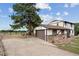 Two-story house with attached garage and stone accents at 352 Antelope Run, Elizabeth, CO 80107