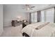 Bright bedroom with sitting area and ample natural light at 8856 Swan River St, Littleton, CO 80125