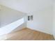 Bright bedroom with wood flooring and window at 2115 Coronado Pkyn # B, Denver, CO 80229