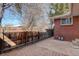 Brick patio and wood fence creating a private backyard at 6193 S Prescott St, Littleton, CO 80120