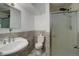 Basement bathroom with a shower, toilet and updated vanity at 6193 S Prescott St, Littleton, CO 80120