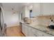 Kitchen with granite countertops and white cabinets at 6193 S Prescott St, Littleton, CO 80120