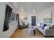 Living room with gray couches, wood floors, and a view at 6193 S Prescott St, Littleton, CO 80120