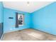 Blue-walled bedroom with carpet flooring and a window at 9008 Madeleine St, Denver, CO 80260