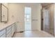 Bathroom with double vanity, quartz countertop and glass shower at 1255 Sunrise Dr, Erie, CO 80516