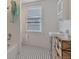 Bathroom with a pedestal sink and black and white floor tile at 1515 E 8Th Ave # 5, Denver, CO 80218