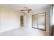 Bedroom with ceiling fan, sliding mirrored closet doors, and carpeted floors at 8909 Field St # 96, Broomfield, CO 80021