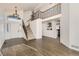 Two-story entryway with hardwood floors and an open staircase at 16272 Willowstone St, Parker, CO 80134