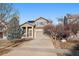 Two-story house with a landscaped yard and attached garage at 23541 E Portland Way, Aurora, CO 80016