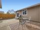 Brick patio with table and chairs near detached garage at 9324 N Ingalls St, Westminster, CO 80031