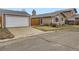 Front view of a ranch home with a white garage door at 9324 N Ingalls St, Westminster, CO 80031