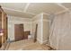 Unfinished basement room with exposed framing, plastic sheeting, and flooring materials at 1000 E 1St Ave # 405, Denver, CO 80218