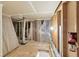 Unfinished basement with exposed framing, plastic sheeting and storage materials at 1000 E 1St Ave # 405, Denver, CO 80218