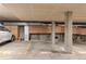 Indoor parking garage with storage units and parking spaces at 1000 E 1St Ave # 405, Denver, CO 80218
