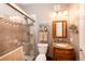 Bathroom with a shower/tub combo, granite countertop, and updated fixtures at 12711 Colorado Blvd # 912, Thornton, CO 80241